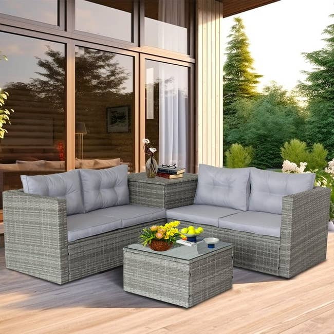 gray outdoor patio set with sectional, a storage ottoman, and another storage side table