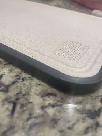 Close-up of a sleek telephone  lawsuit  connected  a granite surface, showcasing its textured plan  and durable corners