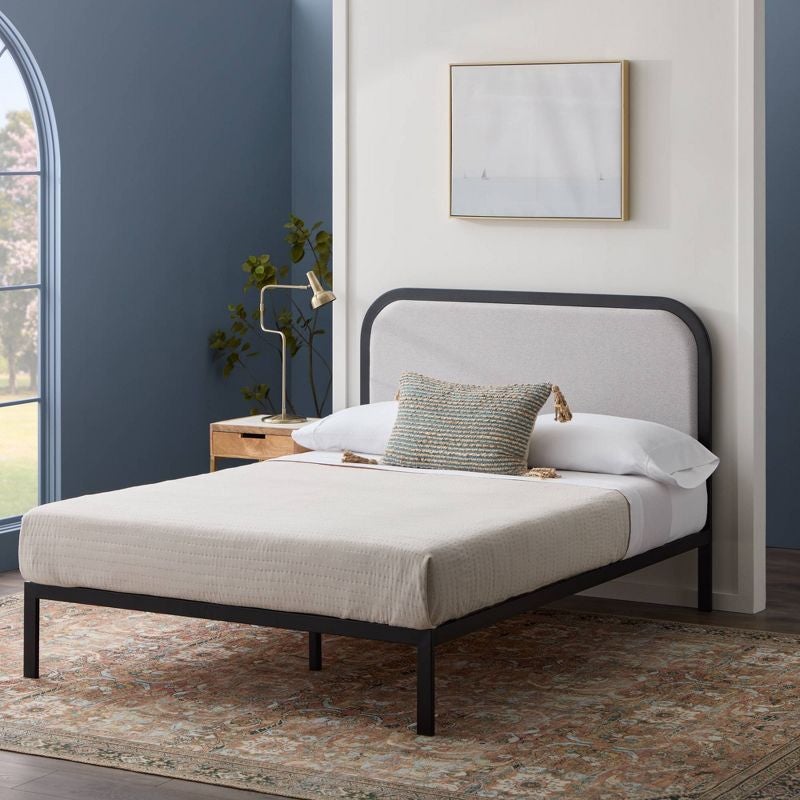 lifestyle photo of platform bed with rounded headboard