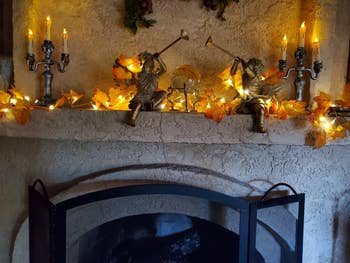 Another reviewer photo of the lighted garland on fireplace mantle