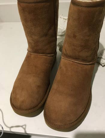same reviewer's pic of the same ugg boots cleaned and now without stains