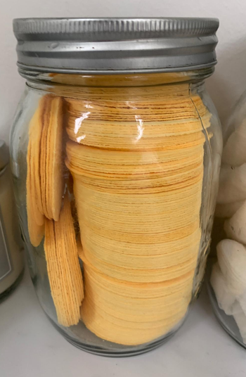 A reviewer's face sponges stored in a jar