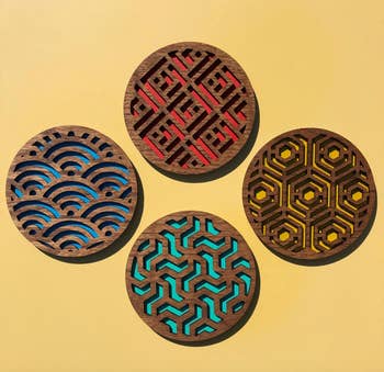 product image of four geometric wooden coasters
