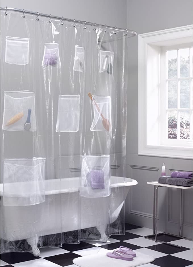 clawfoot bathtub with clear shower curtain organizer