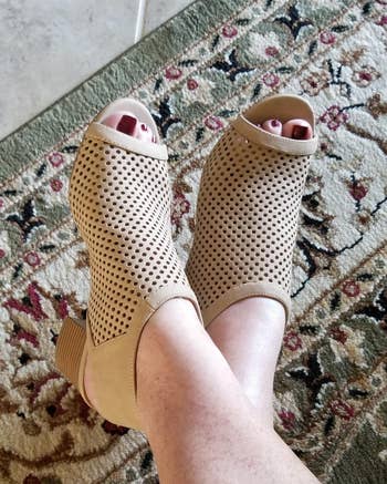 reviewer wearing tan peep toe booties