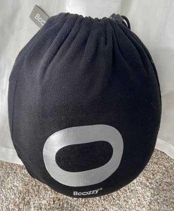a reviewer photo of the pillow inside the included storage bag 
