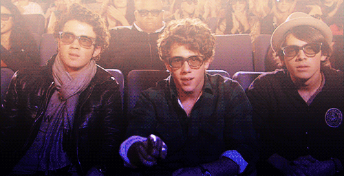 a gif of the jonas brothers in jonas brothers: the concert experience 
