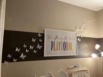 Reviewer's photo showing the butterfly decals in their kid's playroom