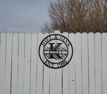 Reviewer image of product hung on white fence