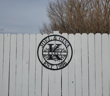 Reviewer image of product hung on white fence
