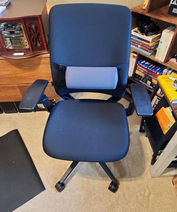 An ergonomic office chair with lumbar roll attached