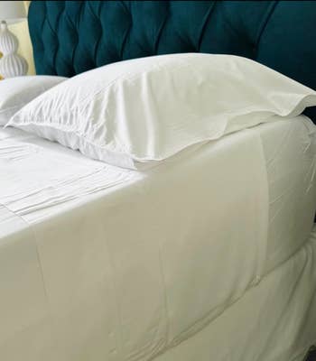 white sheets on a bed 