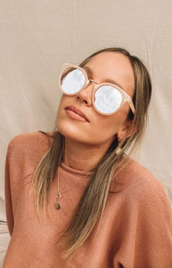 A model wearing the beige sunglasses