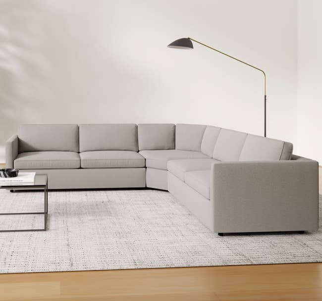 lifestyle image of L-shaped gray couch in living room