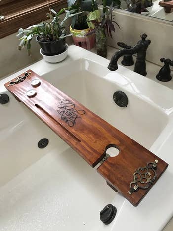 a wooden tray placed over a bath tub