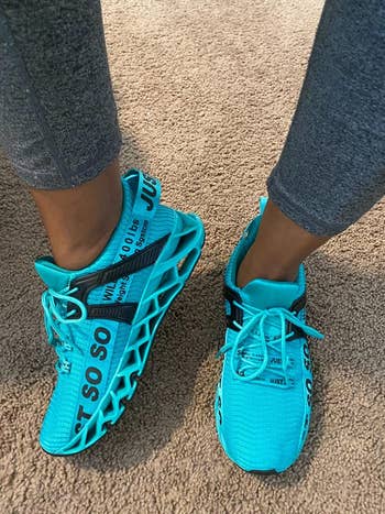reviewer wearing the sneakers successful  agleam  blue