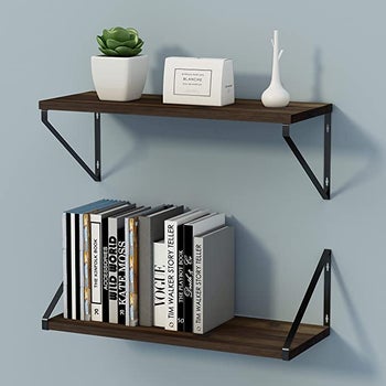 set of two industrial floating shelves mounted on a wall