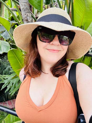reviewer wearing sunhat