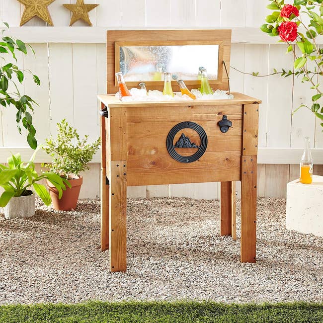Portable wooden outdoor bar station with storage shelf and metal towel holder