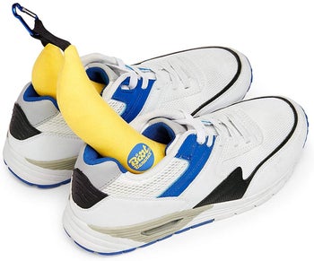 the boot bananas in a pair of white, blue, and black sneakers