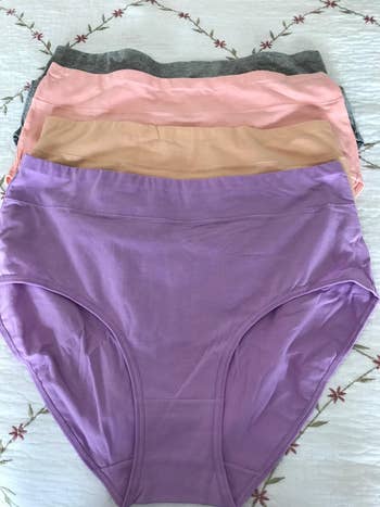 reviewer photo of four panties laid out