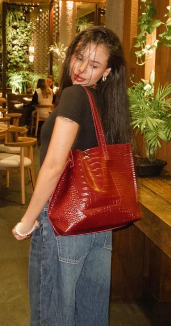 person wearing tote bag