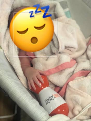 reviewers baby sleeping with orange and white baby shusher