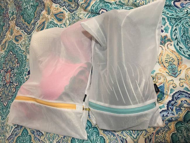 reviewer photo of two full mesh laundry bags 