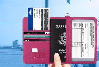a model with the open passport holder showing all the things that can fit inside
