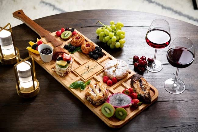 the personalized serving tray with a variety of tapas on it