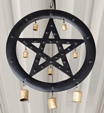 Circular chime with pentagram design and hanging bells