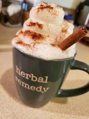 The reviewer's frothy drink with a cinnamon sticking out