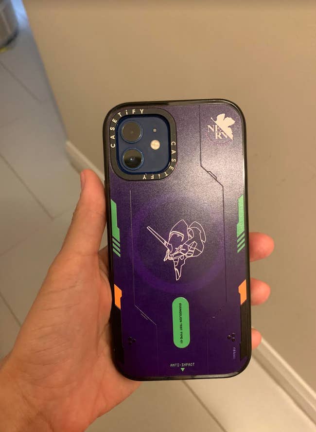 hand holding the purple phone case