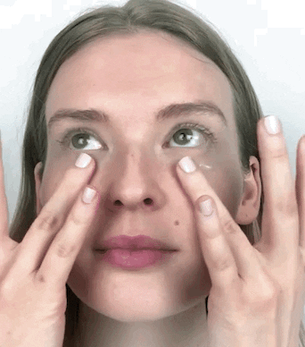 gif of a model using eye cream under their eyes