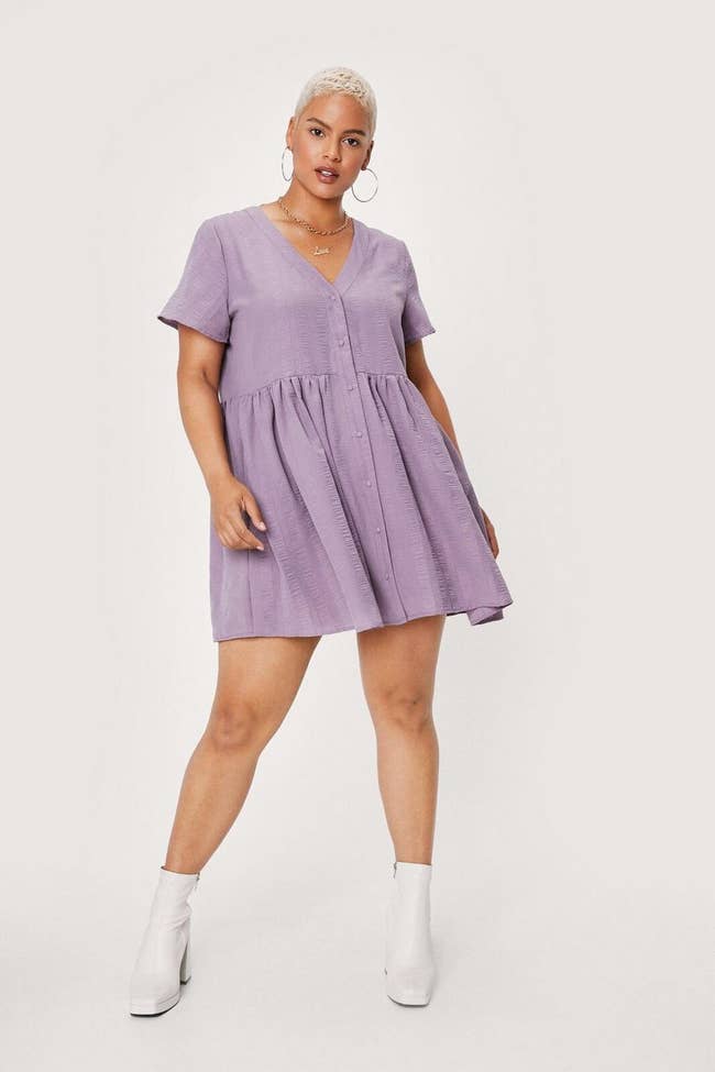 model wearing purple dress