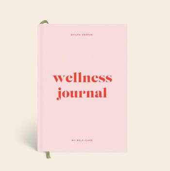 a pink journal that says 