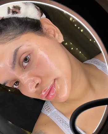 reviewer with clean and glowing skin after using the cleansing oil