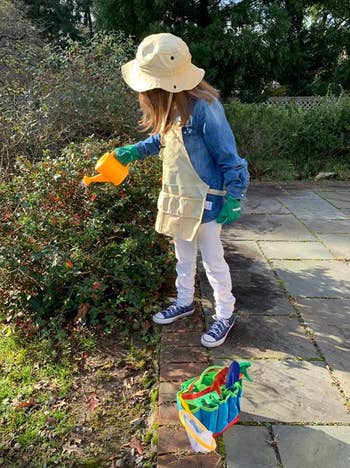 reviewer image of a kid using the set to garden