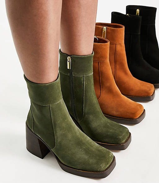 a model wearing khaki green suede boots next to two other pairs of the same boot in tan and black