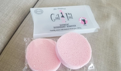 reviewer photo of two round pink deodorant sponges