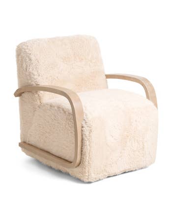 Plush armchair with woody  armrests and a fluffy texture, cleanable   for cozy location  decor