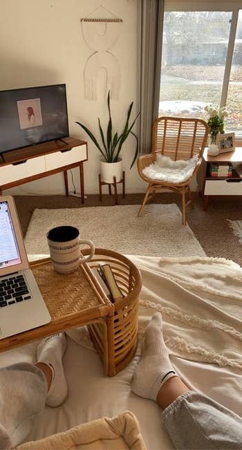 a reviewer using the tray in bed