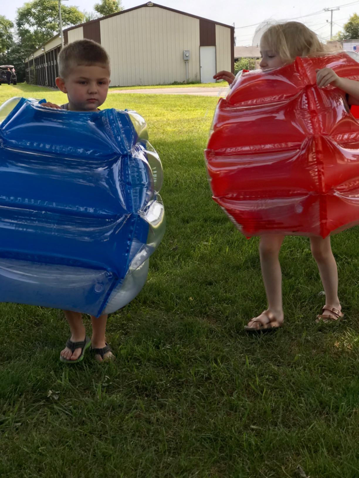 Reviewer's children wearing the body bumpers outdoors