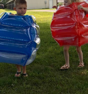 Reviewer's children wearing the body bumpers outdoors