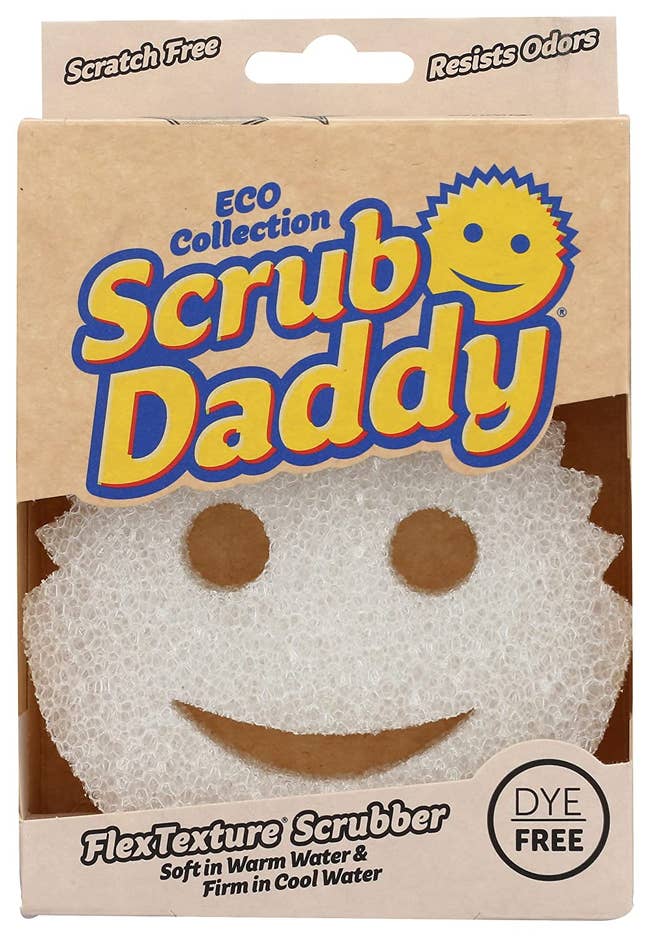 White sponge with a smiley face in its packaging 
