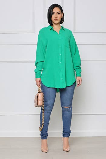 model in oversized green shirt