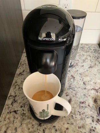A reviewer's nespresso on the counter