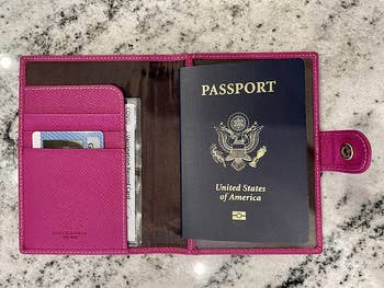 reviewer photo of passport inside pink leather passport holder