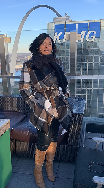 Reviewer wearing coat in neutral patterning