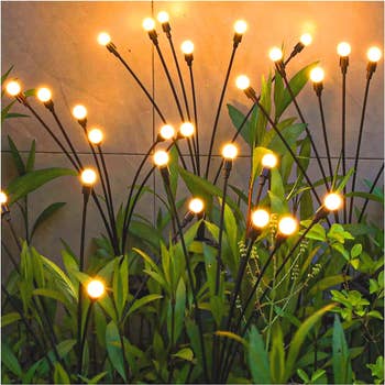 thin solar lights that blow in the wind and look like reeds